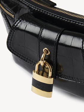 The 99 shoulder bag in croco-effect leather Croco-effect calfskin
Black Front view of the product being worn