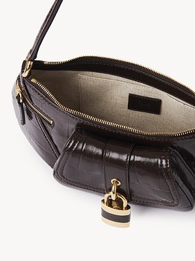 The 99 shoulder bag in croco-effect leather Croco-effect calfskin
Kohl Brown Front view of the product being worn