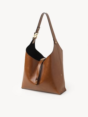 Small Marcie hobo bag in shiny leather Shiny calfskin
Clay Brown Product detail