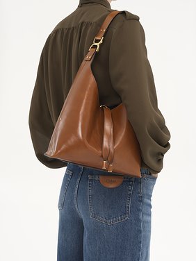 Small Marcie hobo bag in shiny leather Shiny calfskin
Clay Brown Back view of the product