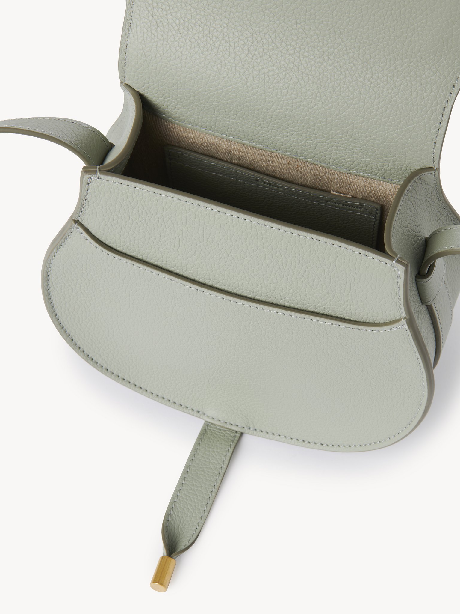 Small Marcie saddle bag in grained leather Grained calfskin
Sea Grass Front view of the product being worn