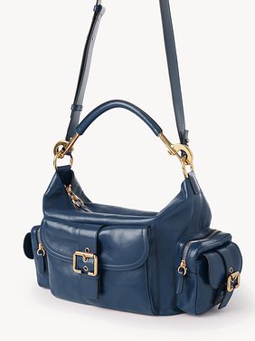 Camera bag in shiny leather Natural shiny buffalo leather
Tapestry Blue Product detail