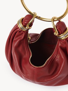 Small Bracelet hobo bag in grained leather Shiny grained calfskin
Red Flame Front view of the product being worn