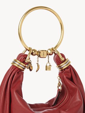 Small Bracelet hobo bag in grained leather Shiny grained calfskin
Red Flame Front view of the product being worn