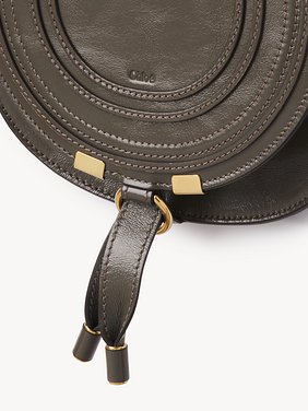 Small Marcie saddle bag in shiny leather Shiny calfskin
Flannel Grey Front view of the product being worn