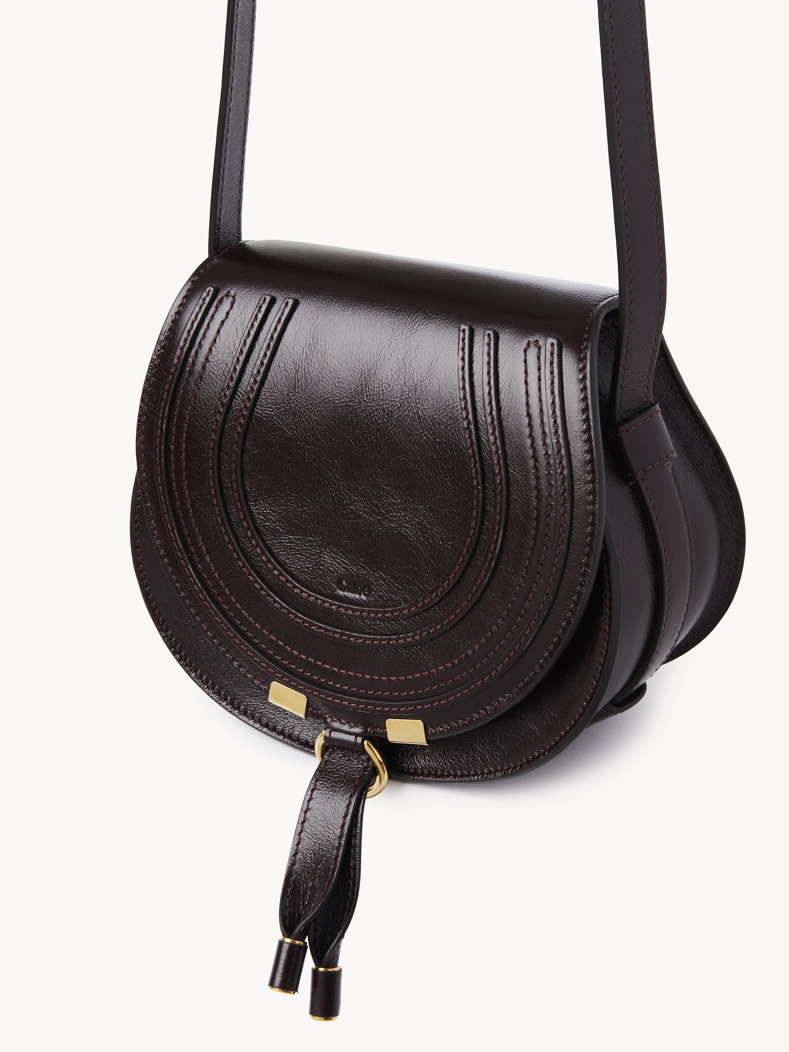 Small Marcie saddle bag in shiny leather Shiny calfskin
Auburn Red Product detail