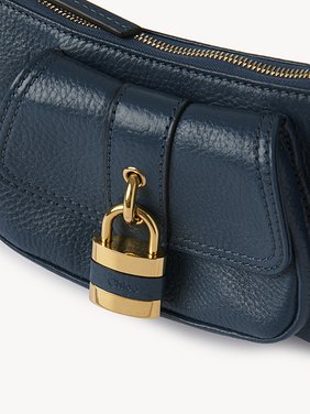 The 99 shoulder bag in grained leather Shiny grained calfskin
Tapestry Blue Front view of the product being worn