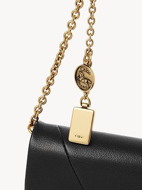 Chloé Spin flap wallet on chain in grained leather Grained buffalo leather
Black Front view of the product being worn