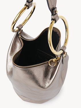 Small Bracelet handbag in metallised leather Metallised calfskin
Shiny Grey Front view of the product being worn