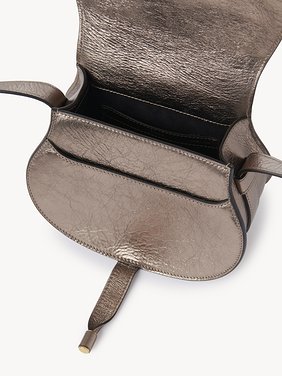 Small Marcie saddle bag in metallized leather Metallized calfskin
Shiny Grey Front view of the product being worn