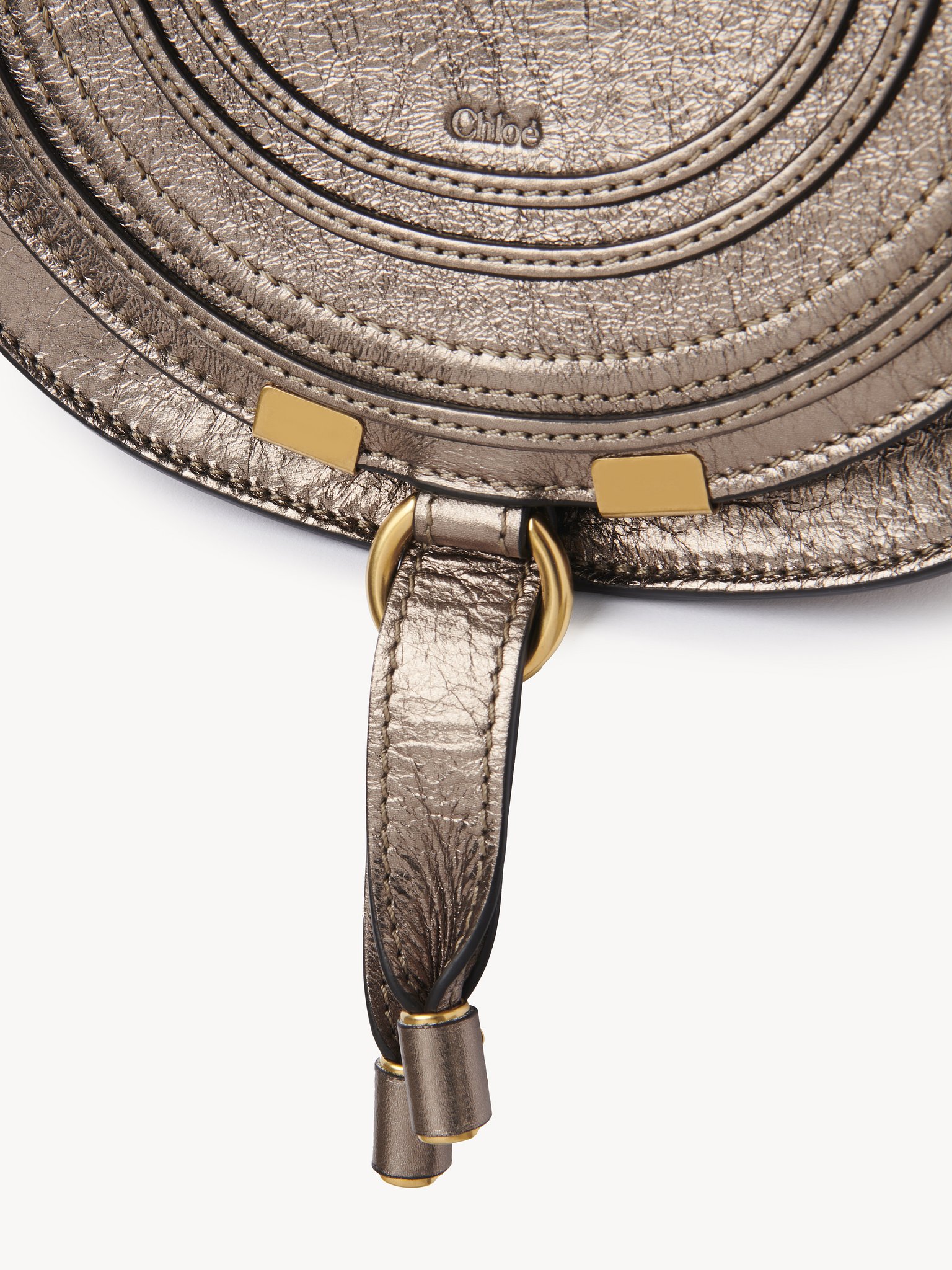 Small Marcie saddle bag in metallized leather Metallized calfskin
Shiny Grey Front view of the product being worn