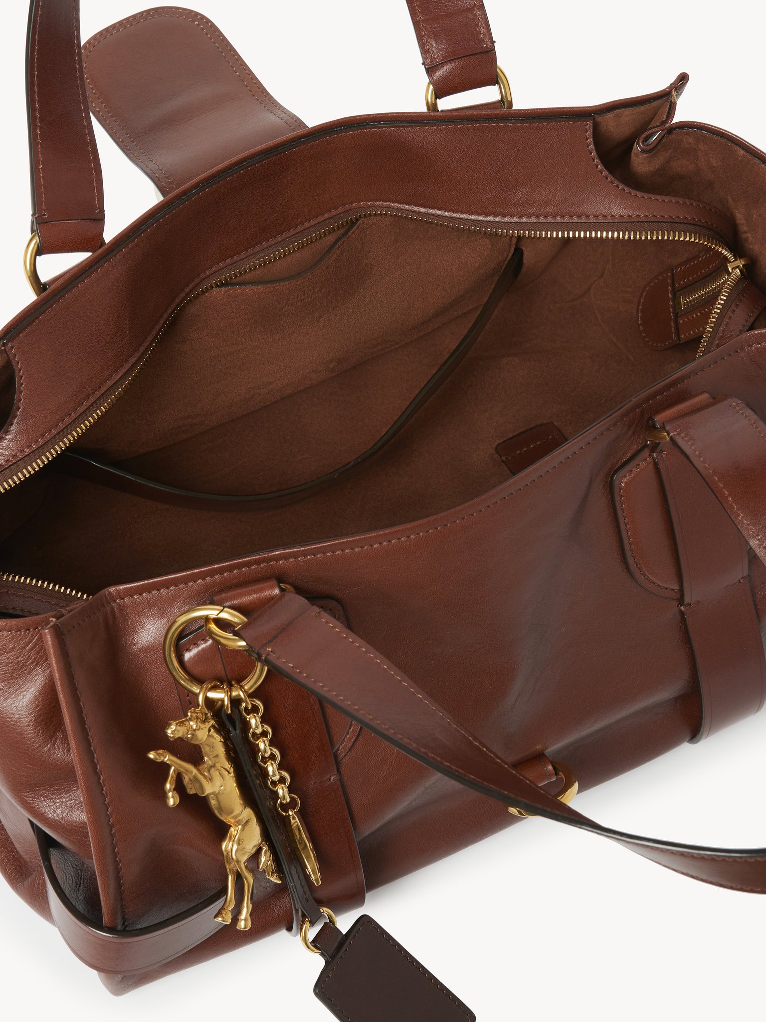 Kerala 25 handbag in soft leather Smooth & natural calfskin
Dark Ebony Front view of the product being worn