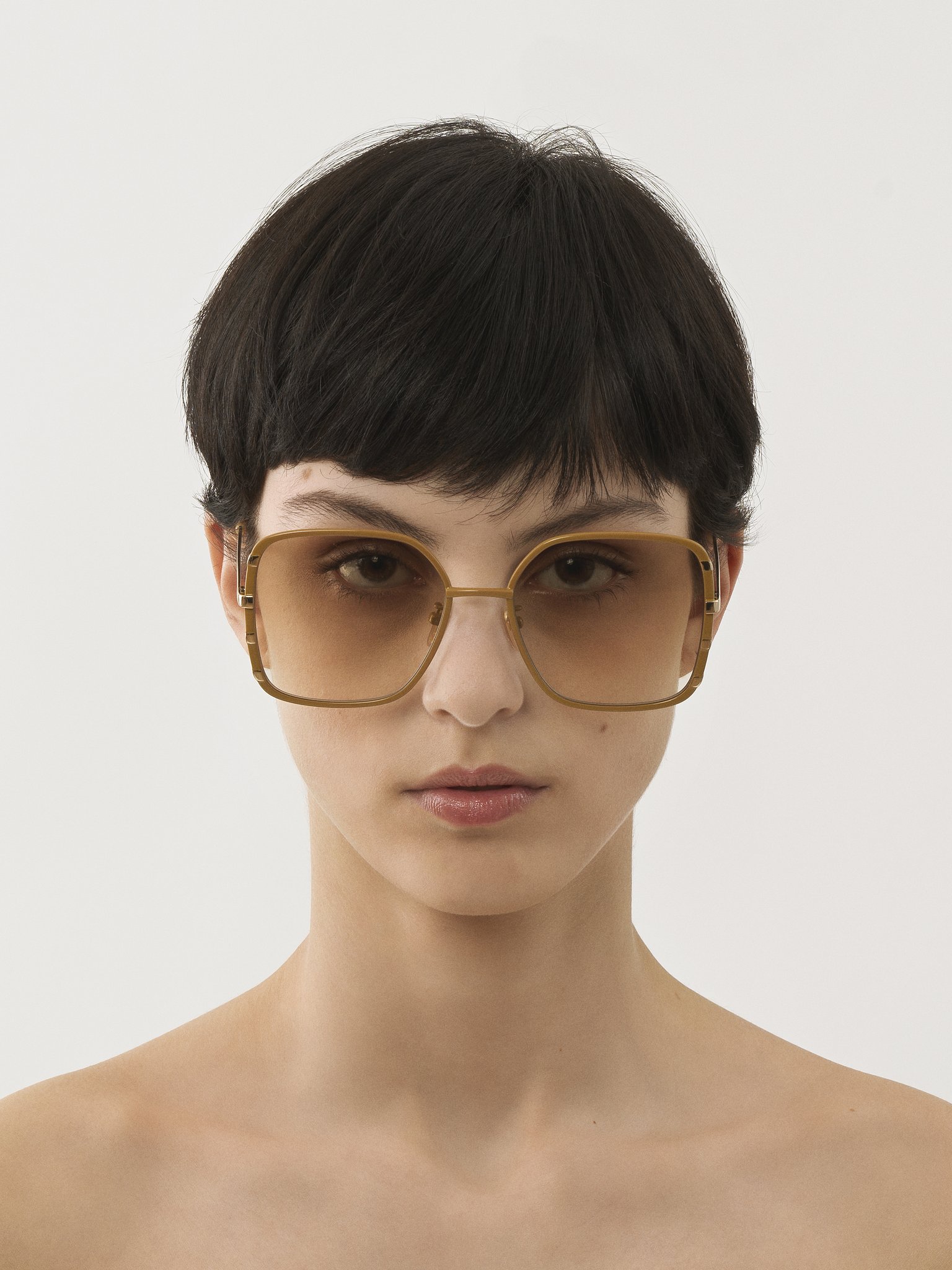 Celeste sunglasses Ochre & gold metal
Gradient light brown lenses Top view of the product