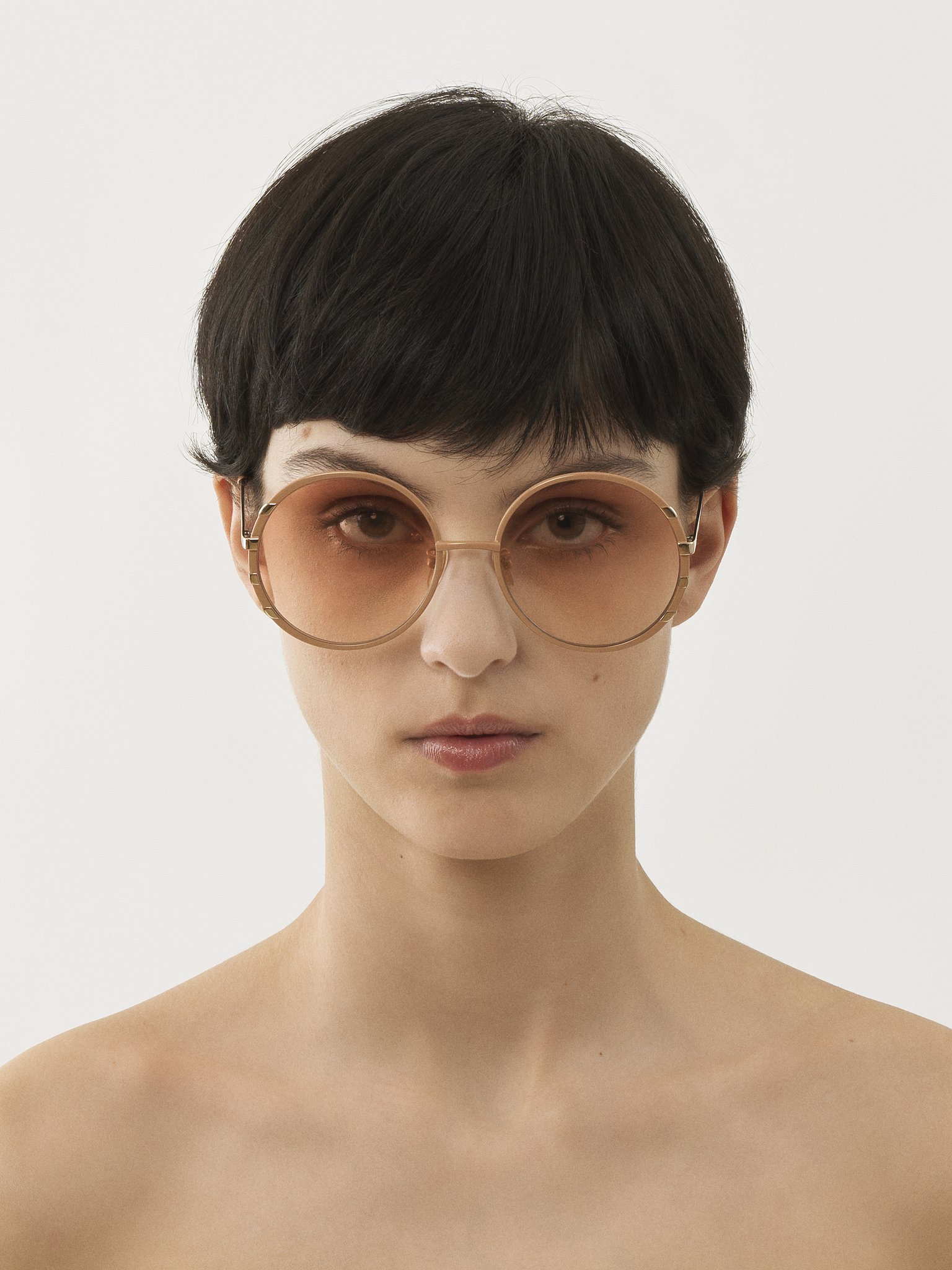 Celeste sunglasses Nude & gold metal
Gradient coral lenses Top view of the product