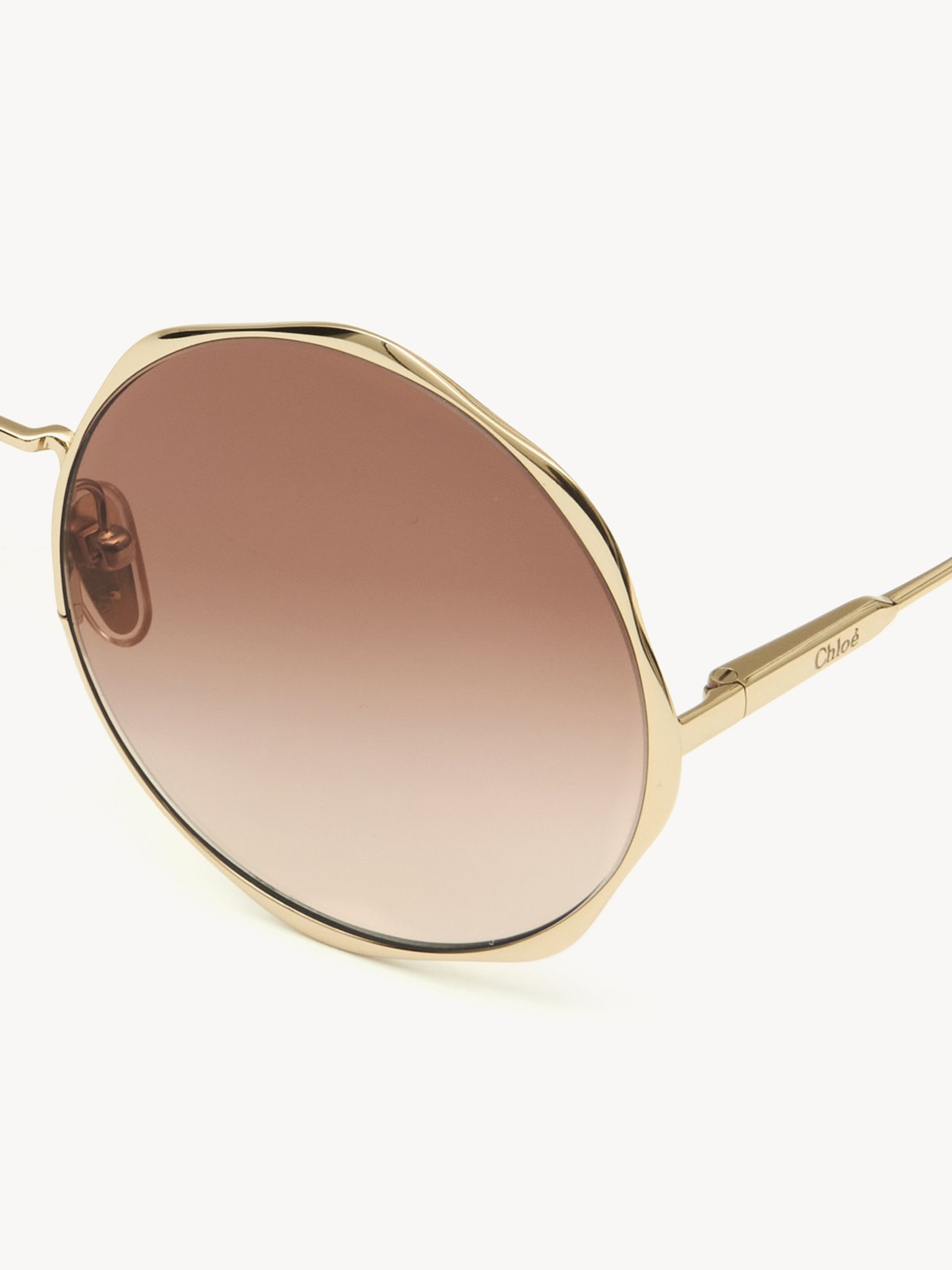 Honoré sunglasses Gold metal & bio-based nylon
Gradient Rust lenses Product detail