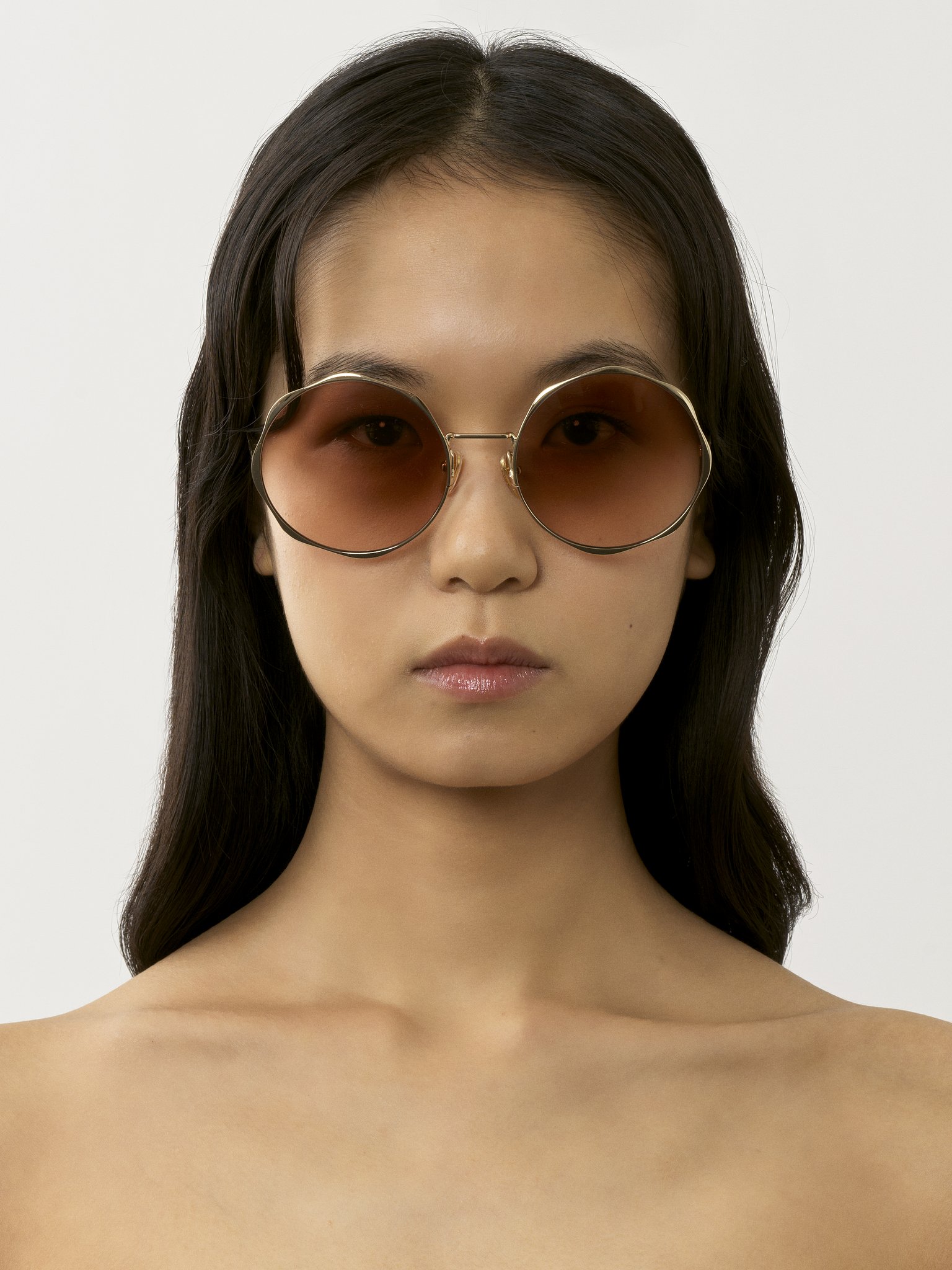 Honoré sunglasses Gold metal & bio-based nylon
Gradient Rust lenses Top view of the product