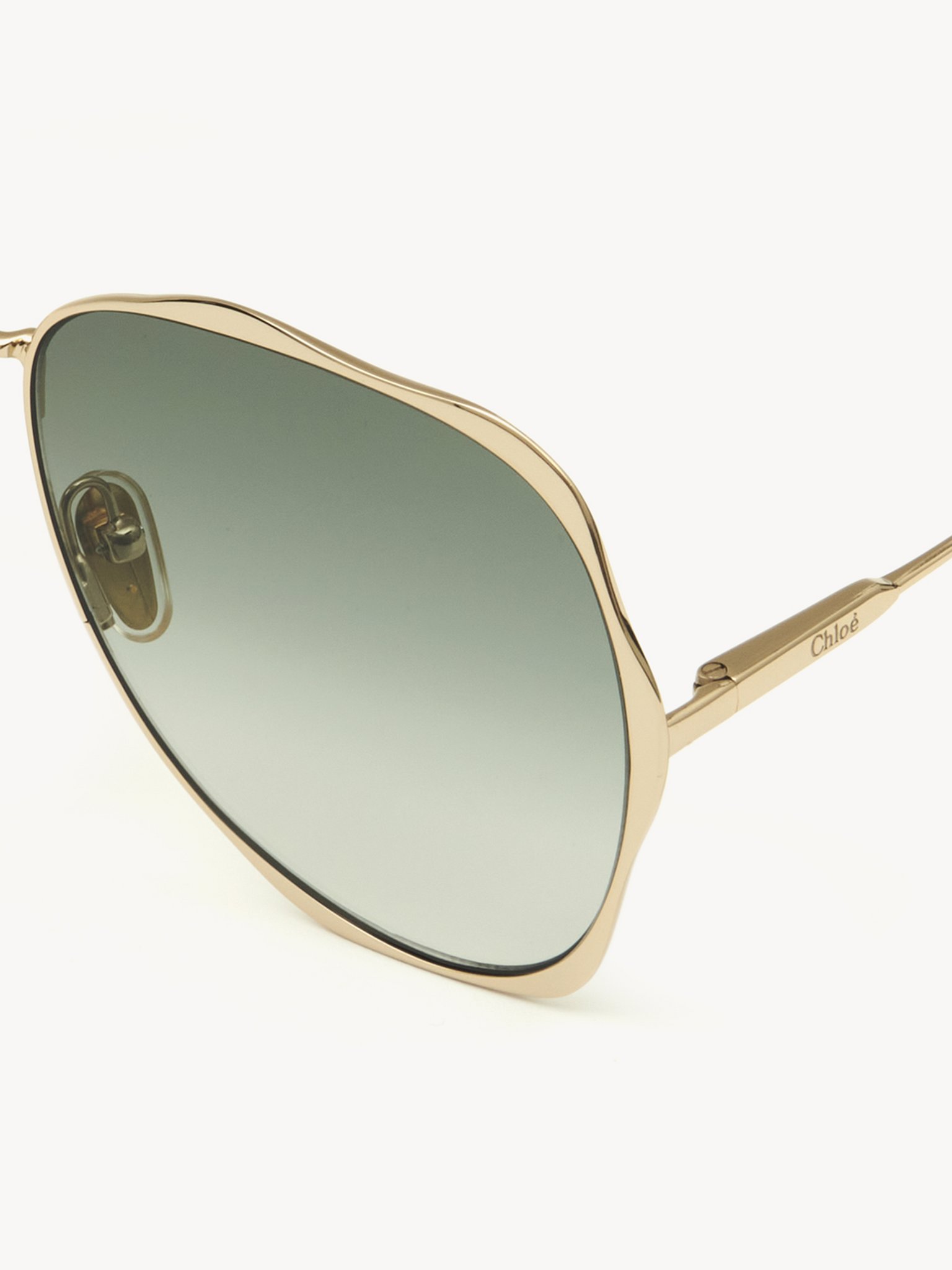 Honoré sunglasses Gold metal & bio-based nylon
Gradient Green lenses Top view of the product