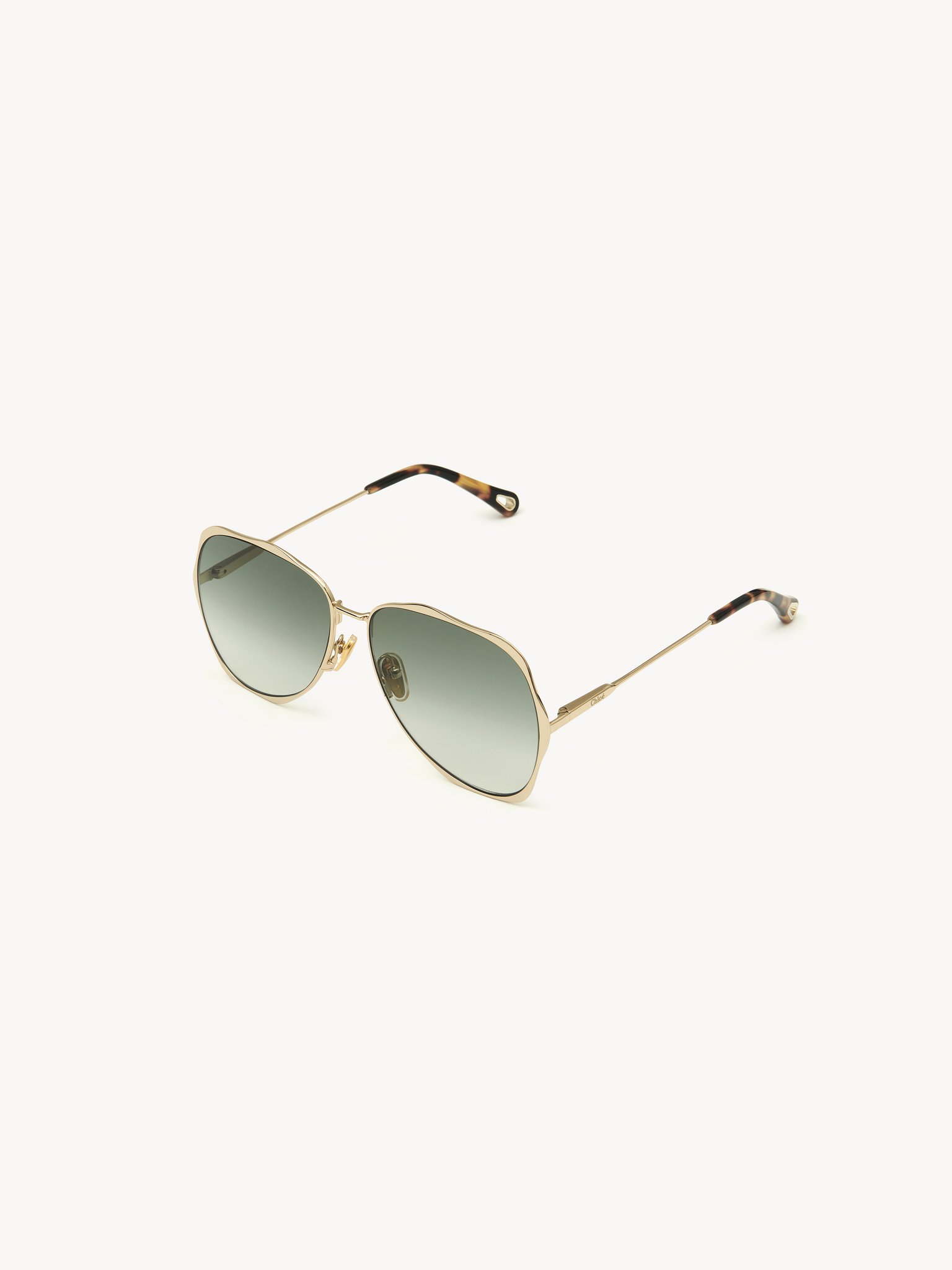 Honoré sunglasses Gold metal & bio-based nylon
Gradient Green lenses