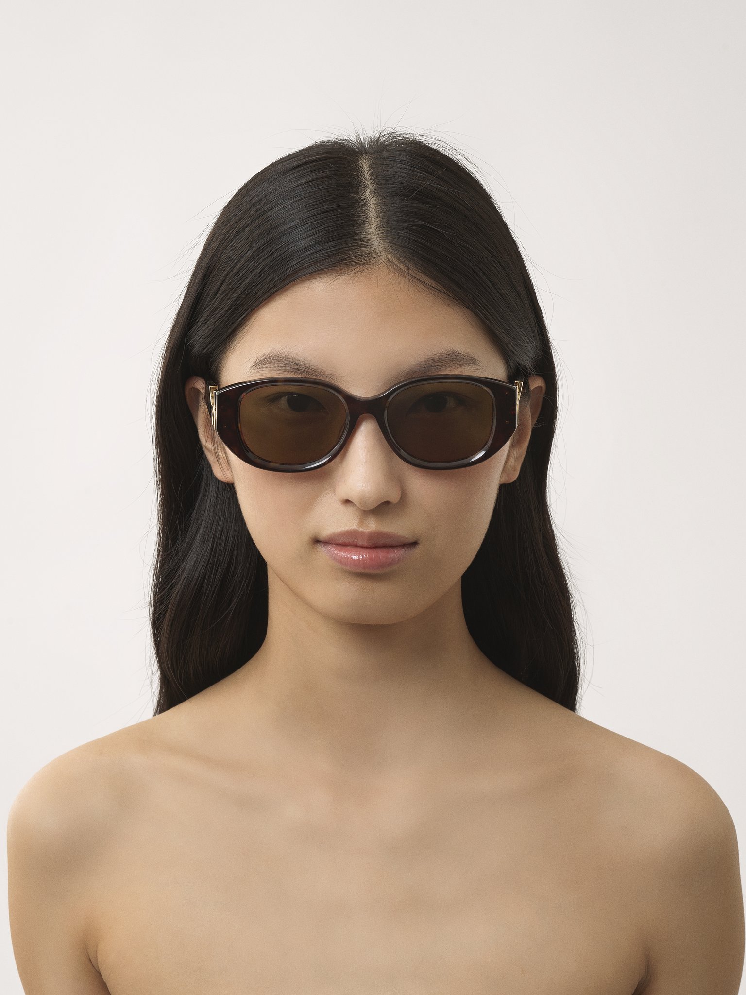 Marcie sunglasses Dark Havana lower-impact acetate & bio-based nylon 
Brown lenses Front view of the product being worn