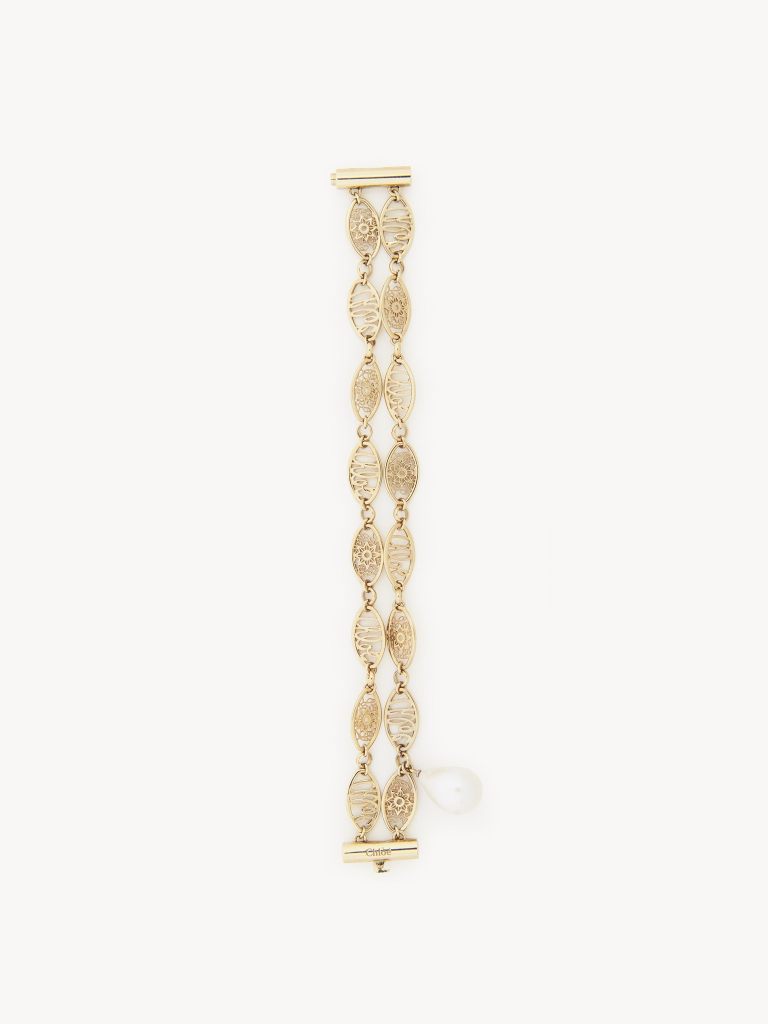 Darcey lace bracelet Brass & cultured freshwater pearl
Gold Back view of the product