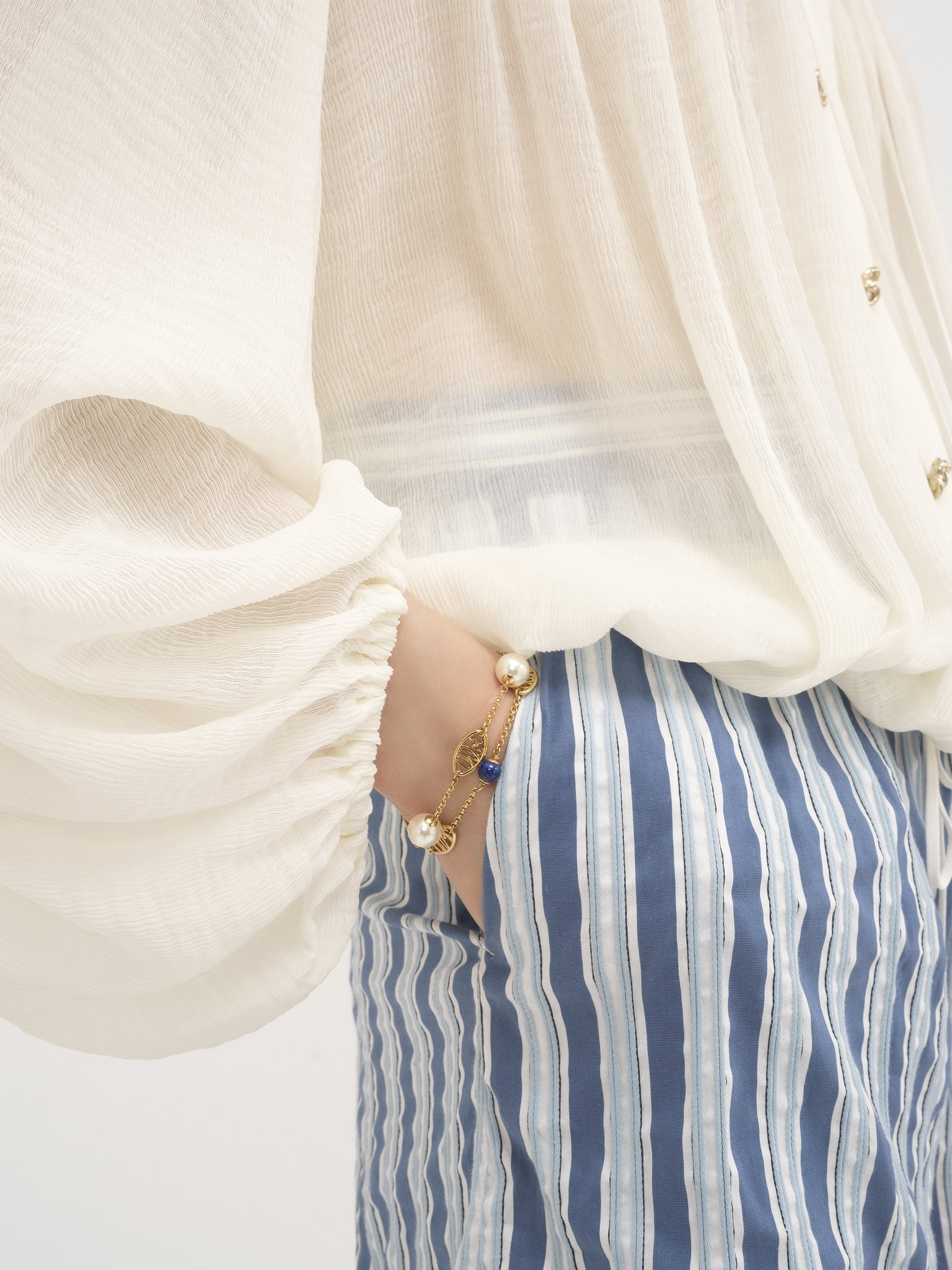 Darcey Lace Bracelet Brass, lapis lazuli & cultured pearl
Bright Gold Product detail