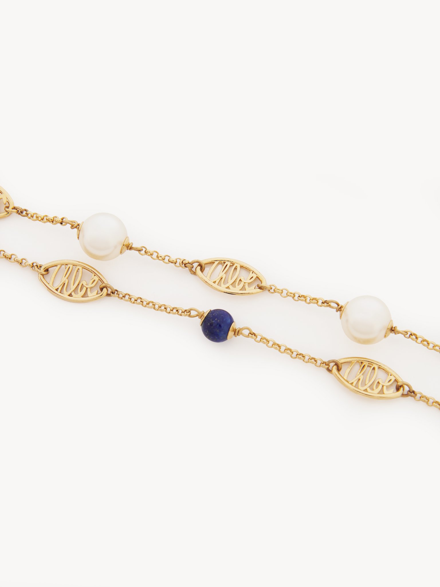 Darcey Lace Bracelet Brass, lapis lazuli & cultured pearl
Bright Gold Back view of the product