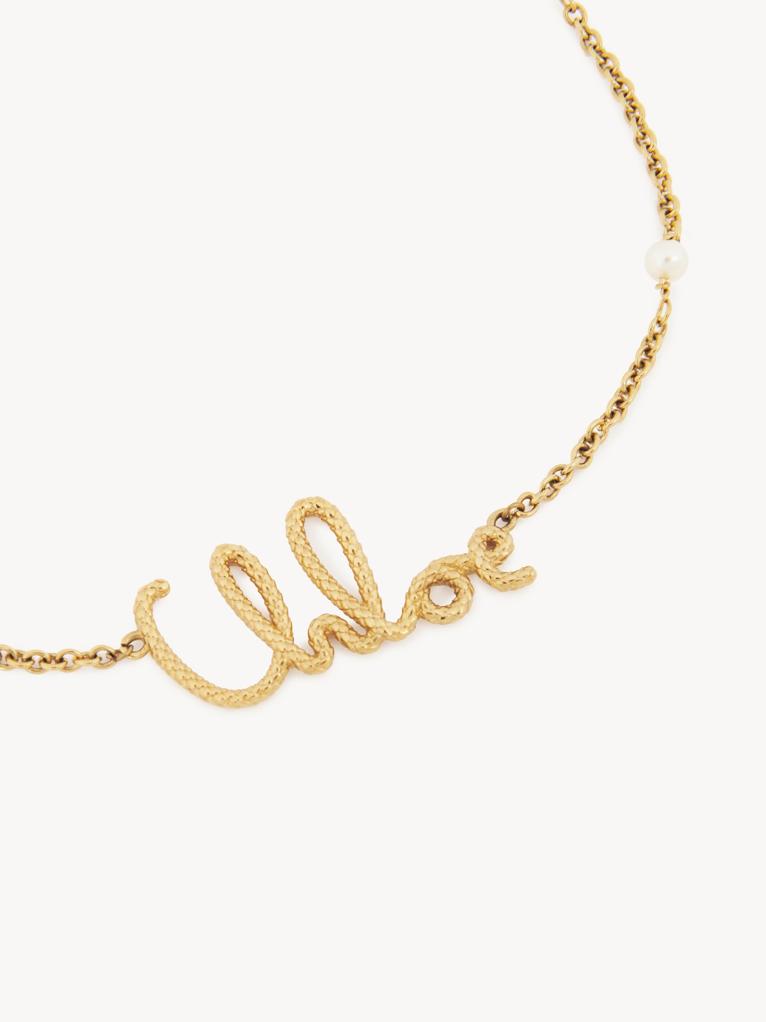 The Chloé Snake necklace Brass & synthetic pearls
Vintage Gold Product detail