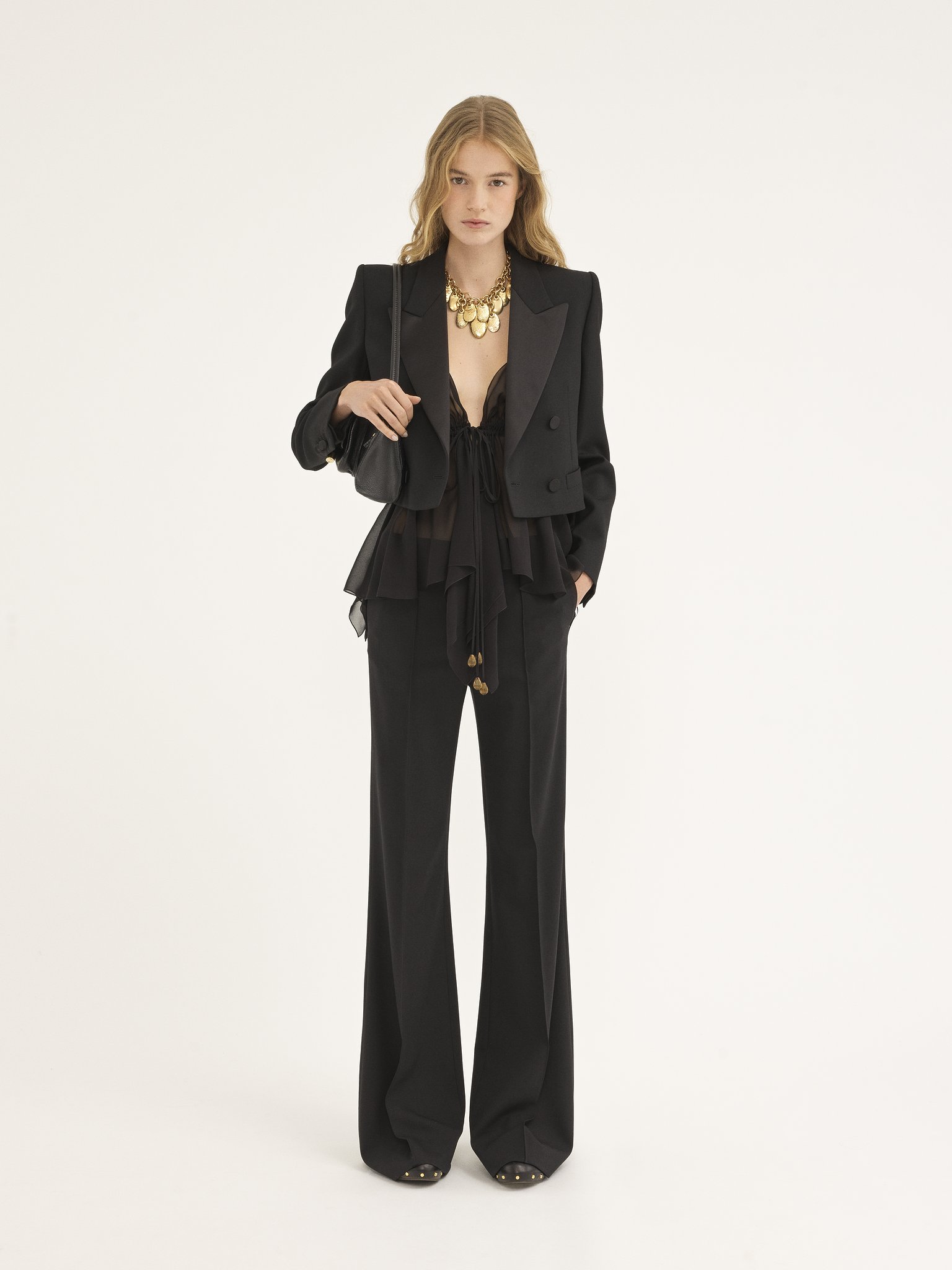 Flare pants in stretch wool Lower-impact stretch wool
Black Back view of the product