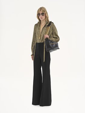 Flared tailored trousers in wool grain de poudre Lower-impact wool grain de poudre
Black Back view of the product