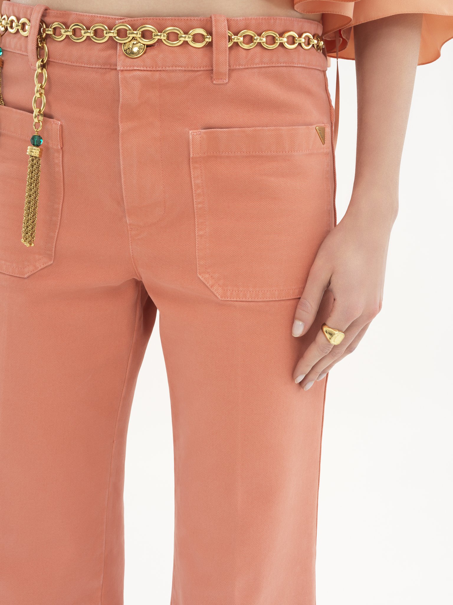 Cropped bootcut trousers in cotton velvet Garment-dyed organic cotton canvas
Shell Coral Front view of the product being worn